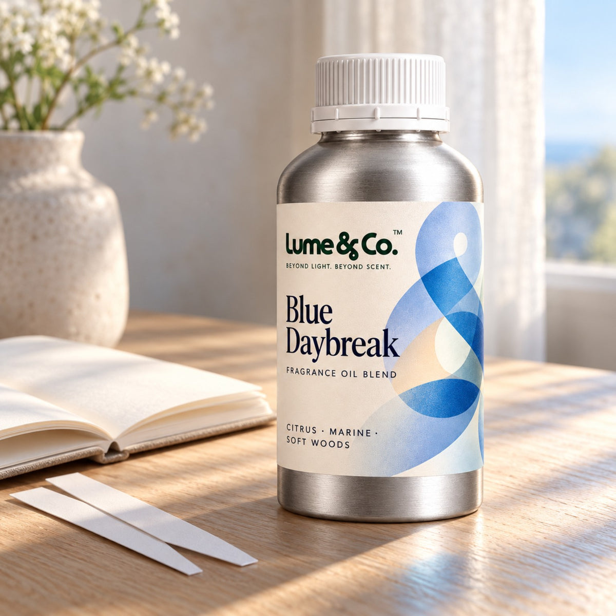 Blue Daybreak fragrance oil blend bottle in a bright airy interior with soft morning light