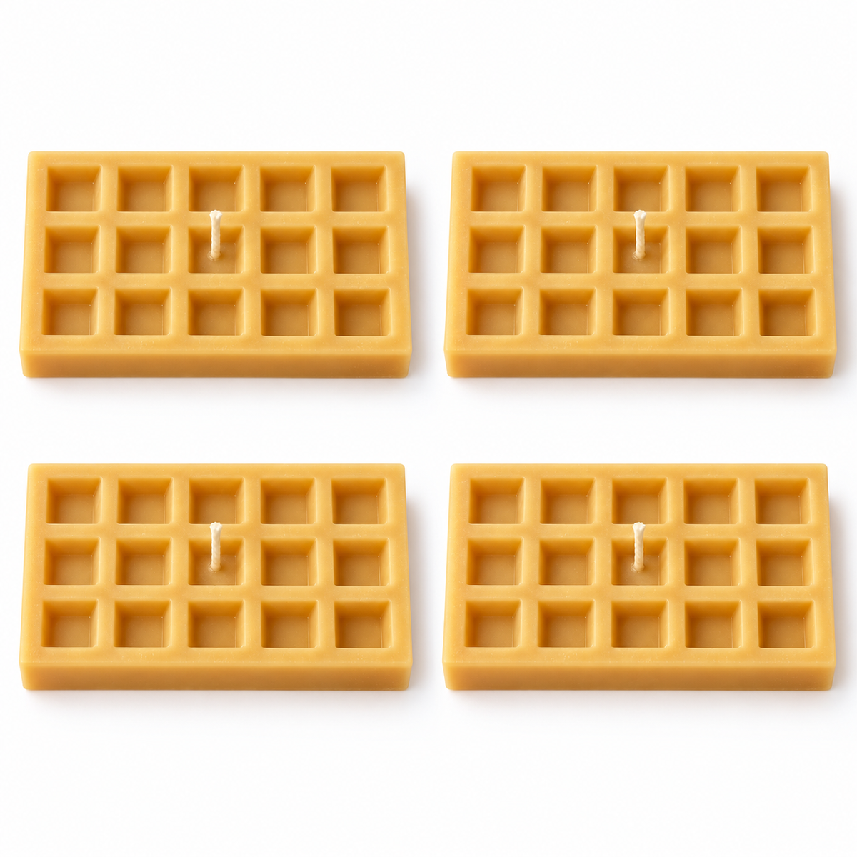 Four illustrative waffle wax candles with fifteen recessed squares each