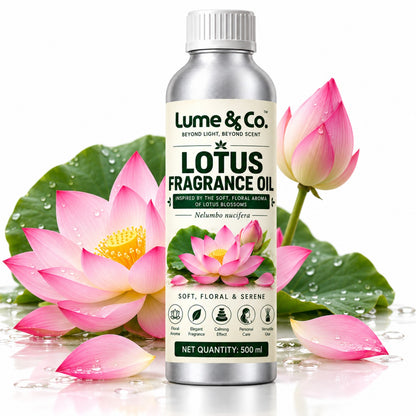Lotus fragrance oil 500 ml bottle surrounded by pink lotus flowers and green leaves