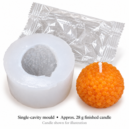 Silicone laddu candle mould with orange 28 g sample candle and clear packaging