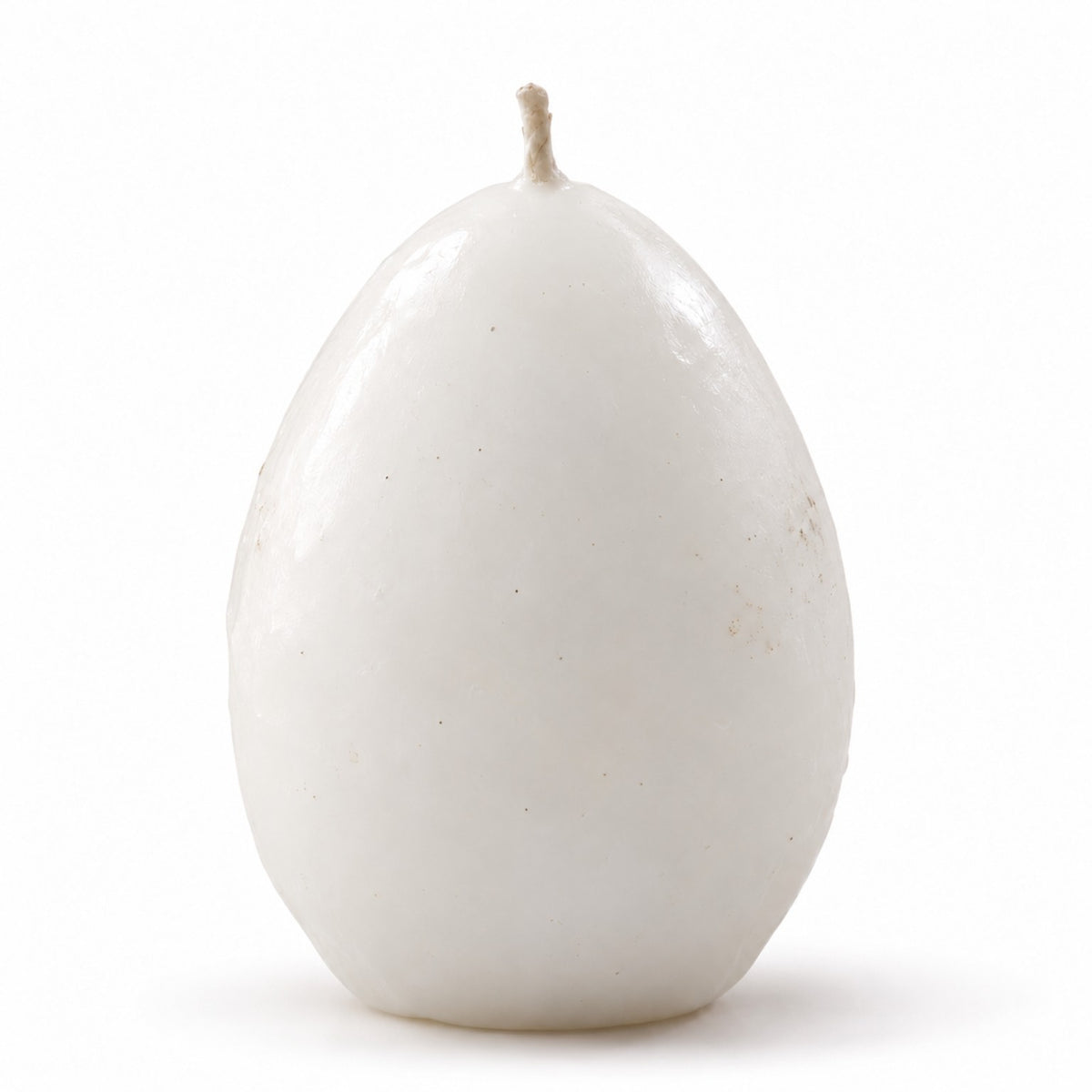 Lume & Co. realistic white egg-shaped candle, single 60 g handmade candle with centered wick on white background