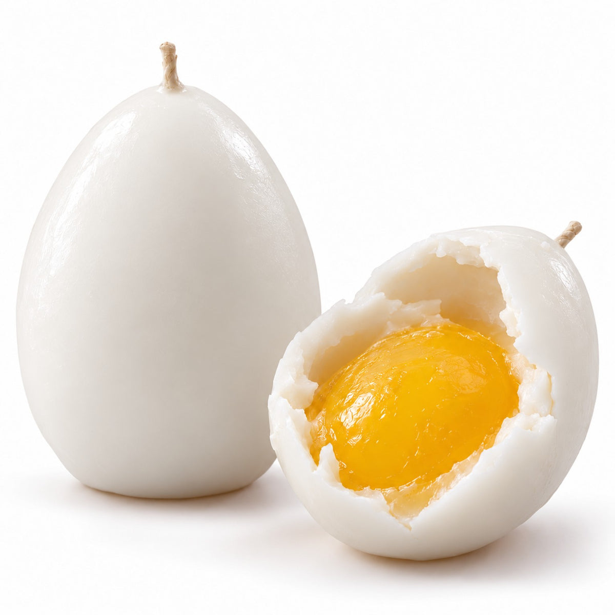 Realistic egg candle white exterior and bright yellow yolk-effect wax interior, product detail on white background
