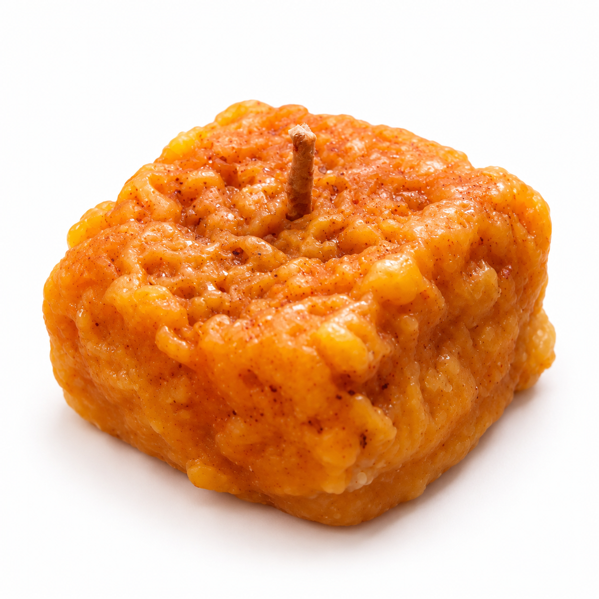 Lume & Co. Dodha Barfi candle, 24 g, orange mithai-inspired scented candle on white background