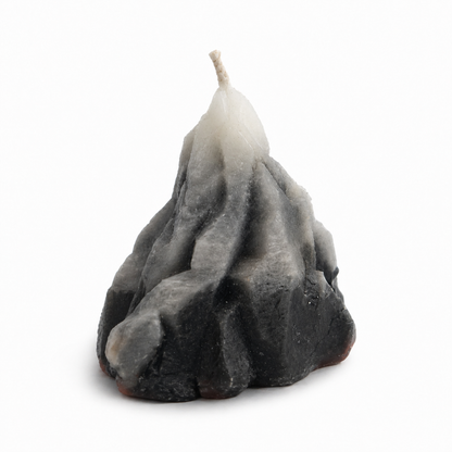 Textured candle with a gradient from gray to white on a white background