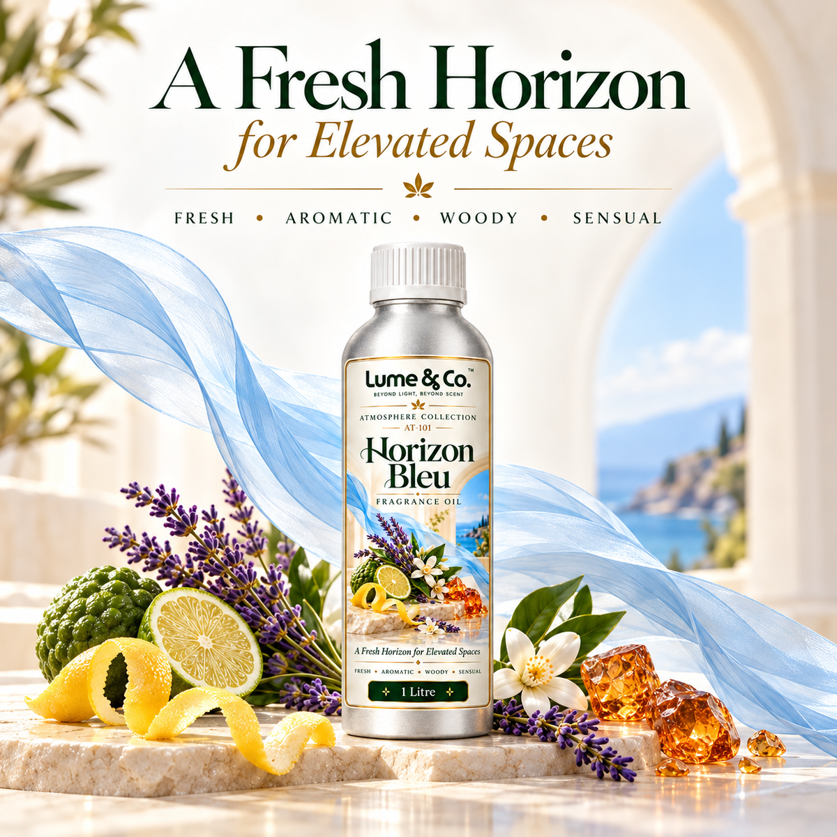 A 1 litre bottle of Lume & Co. Horizon Bleu fragrance oil is displayed on a marble surface with decorative props including lemons, lavender, white flowers, amber crystals, and a blue silk ribbon.