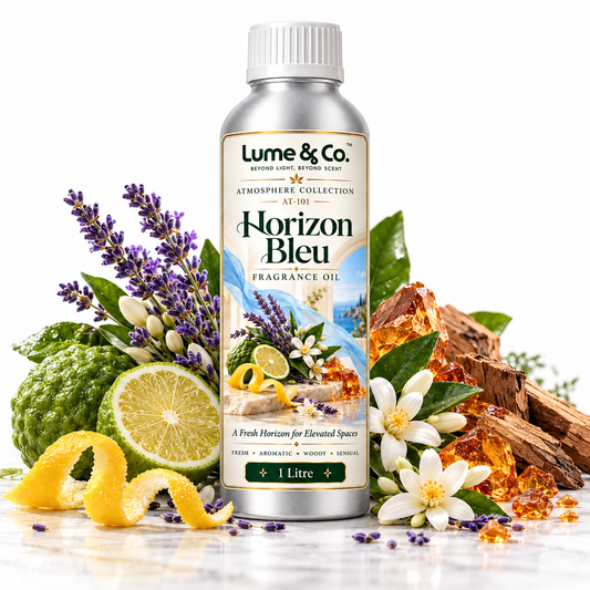 A 1 litre bottle of Lume & Co. Horizon Bleu fragrance oil, styled with fresh citrus, lavender, white flowers, and amber resin crystals on a white background.