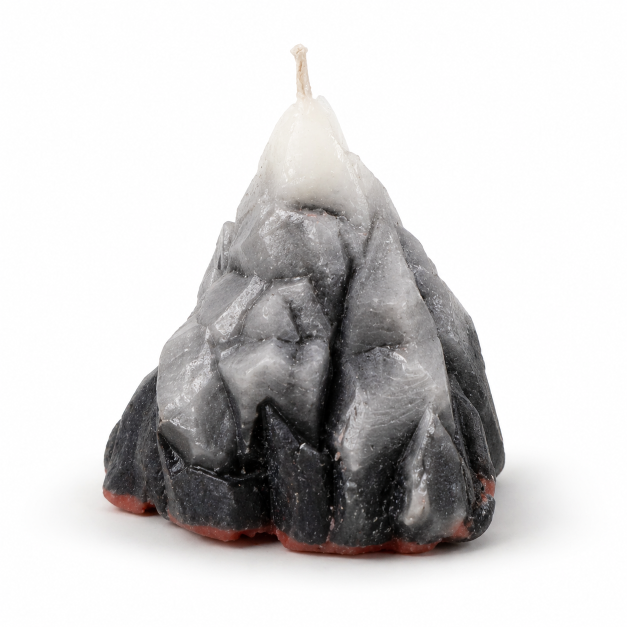 Candle shaped like a mountain on a white background
