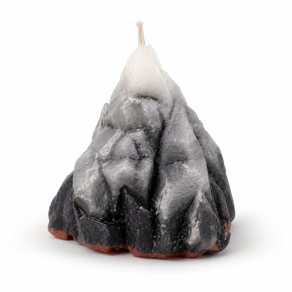 Candle shaped like a mountain on a white background