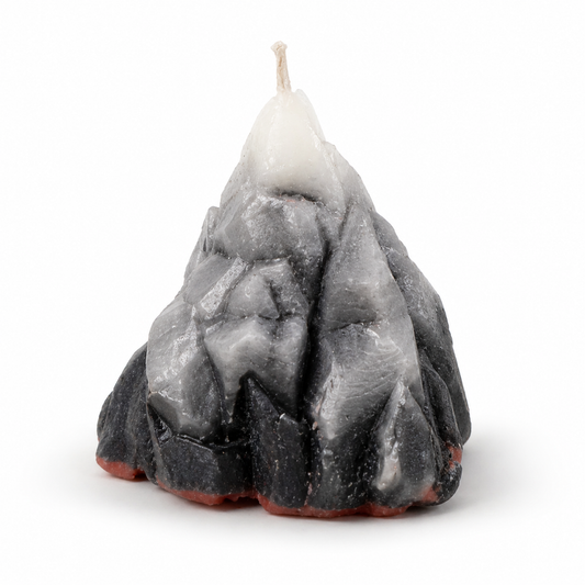Candle shaped like a mountain on a white background